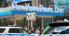 An image of the front of a New York Police building with a traffic sign in front. This article is about "how easy is it to get fired from the NYPD?"